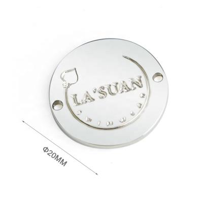 China Custom Nickel Metal Clothing Labels with 2 Holes Round Shape Sewing Metal Logo Tag for sale