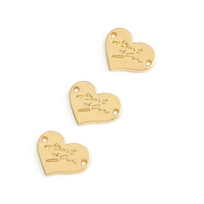 China Glossy Finished Heart Shape Sewing Metal Cloth Label for Swimwear Garment Accessories for sale