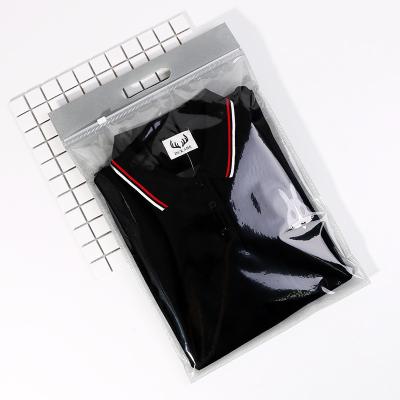 China Logo Printed Waterproof Custom T-shirt Clothing Plastic Black Non Woven Ziplock Bag With Die Cut Handle for sale