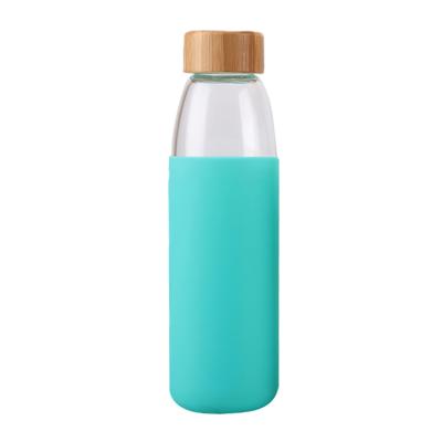 China Viable Reusable Printed Logo Custom Insulated Glass Water Tea Bottle With Wooden Lid for sale