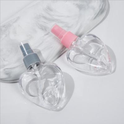 China 50ml Cosmetic Custom PET Loving Keychain Heart Plant Hanging Spray Bottle With Top Hand Sanitizer Cover Butterfly Lip Empty Bottle for sale