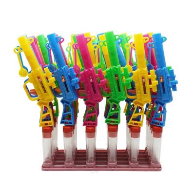 China Cartoon Toys Candy Tube Container Dispenser With Rubber Band Gun for sale