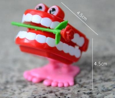 China Wind Up Chattering Jumping Teeth with Rose Flower(for Christmas gift for kids)Jumping Teeth , Funny Teeth for sale