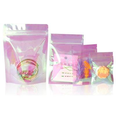 China Moisture Proof In Stock And Custom Zip Lock Light Pink Holographic Plastic Bag Package Bags Small Zipper Resealable Iridescent Pouches for sale