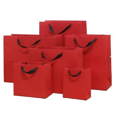 China Recycled Materials Custom Luxury Clothing Bag Retail Packaging Clothes Gift Bag Shopping Kraft Paper Bags for sale