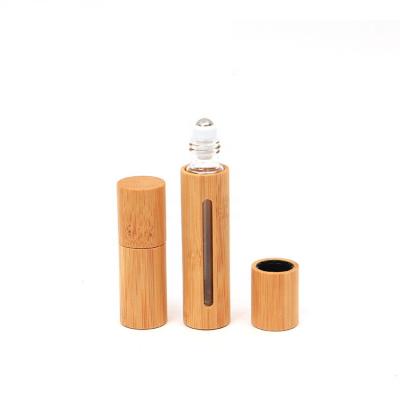 China 5ML 10ML 15ML 20ML Cosmetic Essential Oil Clear Refillable Glass Roll On Bottle With Steel Roller Ball And Bamboo Lid for sale