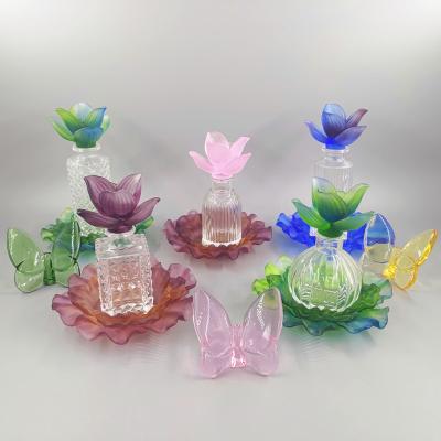 China Arabic Middle East Style Handmade Cheap Crystal Perfume Bottle With Flower And Crystal Base for sale