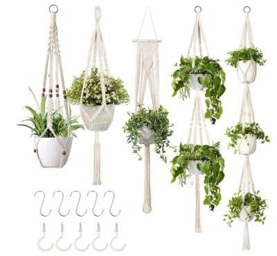 China MOQ Small Modern Home Decorative Macrame Plant Hangers In Different Designs Handmade Indoor Boho Wall Hanging Planter Plant Holder for sale