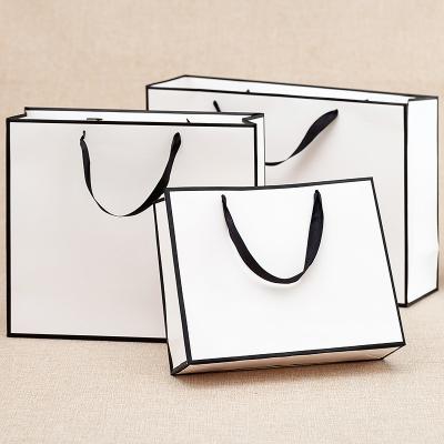 China Factory Price Paper Bag Recyclable Elegant Customized Brand Logo Luxury Boutique White Shopping Bags With Ribbon Handles for sale