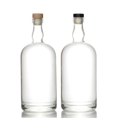 China Beverage Xingda Customized Round 500Ml 750Ml 1000Ml Clear Vodka Liquor Empty Glass Whiskey Bottle With Plug Factory for sale