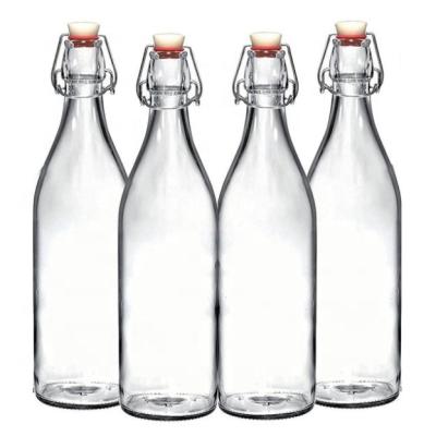 China Hot Selling OEM Crystal White 500ml 700ml 750ml Swing Cap Wine Beer Cocktail Water Drinks Beverage Swing Cap Glass Bottles for sale