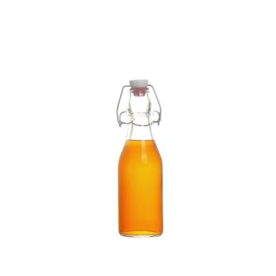 China Classic Liquor Swing Top Glass Bottles Flip Top Glass Bottle With Stopper For Drinks Oil Water Juice Kombucha Wine Vinegar for sale