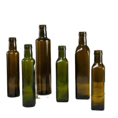 China Custom Xingda Food Round Dark Green Glass Bottle Olive Oil Glass Bottle Factory Essential Oil Vinegar Bottle for sale