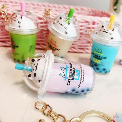 China Creative Cat Pearl Milk Tea Cup Cute Animal Doll Creative Quicksand Drink Keychain Backpack Liquid Floating Key Chain Pendant Gift For Women for sale