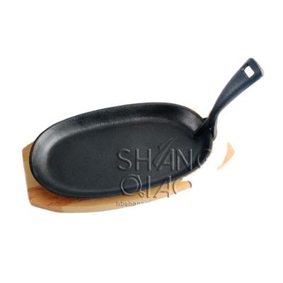 China General Use For Gas And Induction Cooker 9.5x 5.5 Inch Cast Iron Steak Pan Heavy Duty Pre-Seasoned Cast Iron Sizzling Tray With Wooden Offered Cast Iron Sizzling Dish for sale