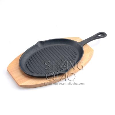 China China Wholesale Price Sustainable Oval Shape Cast Iron Skillet Sizzling Dish With Wooden Tray for sale