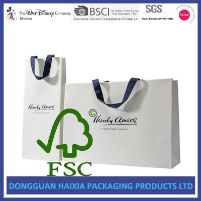 China Ribbon Handle Kraft Paper Gift Bags OEM Logo Printed White Gift Carrier for sale