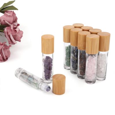 China Personal Care 10ml Roll On Bottle With Gemstone Rollerball Crystal Chips Inside Glass Roller Bottles Essential Oil Sample Bottle Lids Bamboo for sale