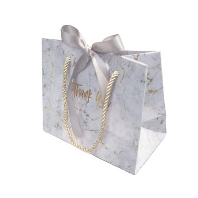 China Recyclable Custom Marbling Wedding Paper Wind Gift Bag With Ribbon for sale