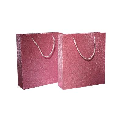 China Recyclable Wholesale Custom Paper Glitter Gift Shopping Bags With Handle for sale