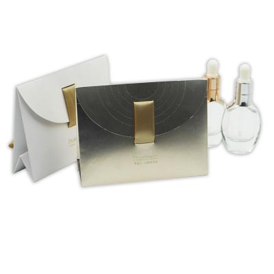 China Recyclable Luxury Custom Silk White Ribbon Cosmetics Bag Colored Foldable Paper Box for sale