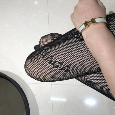 China Big Brand Logo Pantyhose wholesale price breathable mesh pantyhose ladies letter print seamless pantyhose designed pantyhose for sale