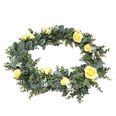 China Realistic looking spring flower hanging garland for wedding stairs layout table runner rose flower arch decoration for sale