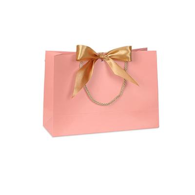 China Recycled Materials Wholesale Luxury Boutique Shopping Tote Custom Butterfly Ribbon Hard Paper Bag Can Be Used In Clothing Stores for sale