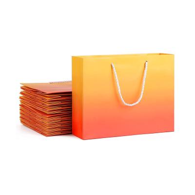 China Custom Materials Orange Color Gift Recycled Luxury Shopping Paper Bag For High Suit Shopping Packaging Boutique Apparel for sale