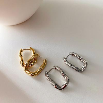 China Retro CLASSIC twisted brass earrings for women simple and soft Korean temperament fashion 18K gold plated circle earrings wholesale for sale