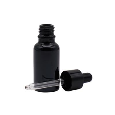 China Empty Essential Oil 50ml 100ml Black Glass Essential Oil Bottle With Black Essential Oil Dropper Cap Wholesale for sale