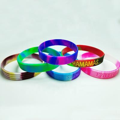 China All Ink Injected debossed fill print embossed glow Rubber bracelet Custom Logo Mixed colors swriled Silicone Wristband for sale