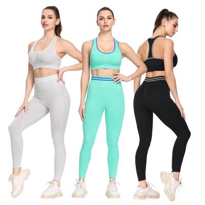 China Breathable Sports Activewear Gym Wear Fitness Clothing Ladies Solid Compression Bra And Leggings Women Yoga Seamless Set for sale