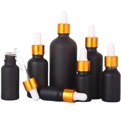 China 2021 Hot Selling Essential Oil Pump Bottle Black Pump Bottle 5ml 15ml 10ml Supplier Low Competitive Price Aluminum Metal Gold Rubber Cap+Glass Pipette+Silicone Collar Essential Gold Foil With Gold hat for sale