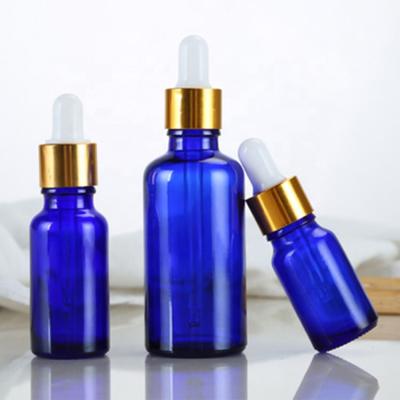 China 15ml Essential Oil Bottles Essential Oil Bottles Blue Cap+Glass Pipette+Silicone Gold Cap Competitive Price Aluminum Rubber Collar Cap+Glass Pipette+Silicone Luxury Essence Perfume Dropper Bottle essential oil for sale