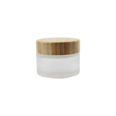 China Eco-Friendly Bamboo Cap With 50 Gram Frosted Glass Wooden Jar 50g Eco-Friendly Luxury Empty Wide Mouth Face Pad Packaging Cosmetic Bamboo Cream Jars With Lid for sale