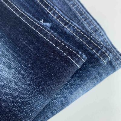 China Wrinkle Resistant Stretch Weft Woven 11.2oz Stock 100% Cotton Blue Denim Fabric for sale