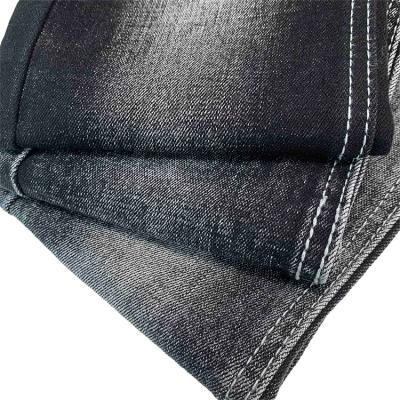 China Wrinkle Resistant Black 11.8oz Stretch Siro Cotton Slub Denim Fabric for sale