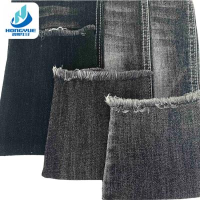 China Stretch 10.5oz Power Stretch Fabric Woven Black Denim Rolls Of Denim Fabric For Jeans for sale