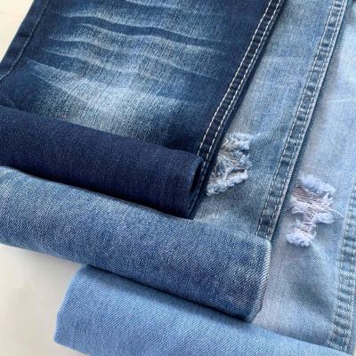 China Wrinkle Resistant 8.1oz Blue Woven 100% Cotton Indigo Denim Fabric Mill Jean Fabric Roll for sale