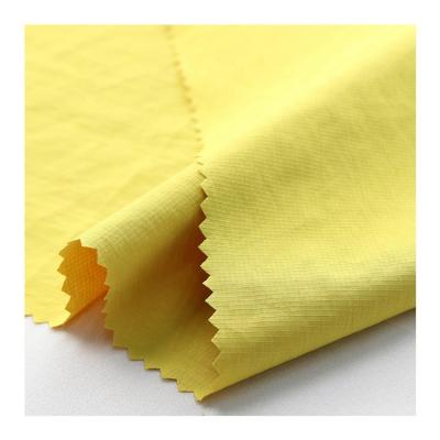 China Downproof Feeling Cotton Ripstop Polyester / Nylon Fabric For Waterproof Clothes for sale