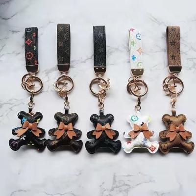 China New Design 5 Color Cute Leather Teddy Bow Leather Bear Personalized Custom Logo Inspired Key Chains for sale