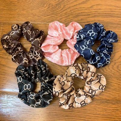 China Fashional Pretty Lady Custom Printed Girls Hair Bands Colors Logo Elastic Custom Hair Scrunchies for sale