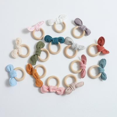 China BPA Free Organic Baby Toys Infant Training Silicone Teether Ring Wooden Ring Rattles Kids Toys for sale