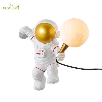 China Modern Modern Space Man G9 LED Wall Lamp Table Lighting Bedside Art Resin Wall Light Bedroom Astronaut Kids Room Lamps for sale