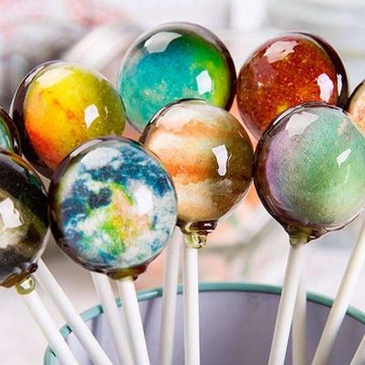 China halal fruit flavor hand made box package OEM planet starry sky lollipop ball hard candy manufacturer for sale