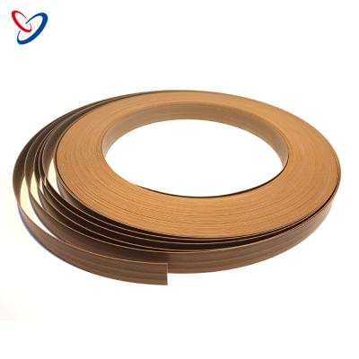 China Eco - Friendly Furniture Accessories Decorative Plastic Flexible Grain Strip PVC Wood Edging for sale