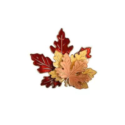 China Cute Japanese Style Stainless Steel Metal Brooch Maple Grass Plants Gold Leaf Elegant Custom Made Custom Design for sale