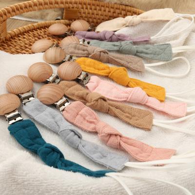 中国 Toy Infant Teething Toy Soft Silicone Pacifier Chain Clips, Wooden Bead Round Pacifier Clip 販売のため