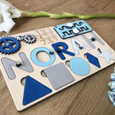 中国 Nursery Educational Busy Decor Board Puzzle Name Toy Custom Wooden Toy Blue Unique Gift with Pegs for Boy 販売のため